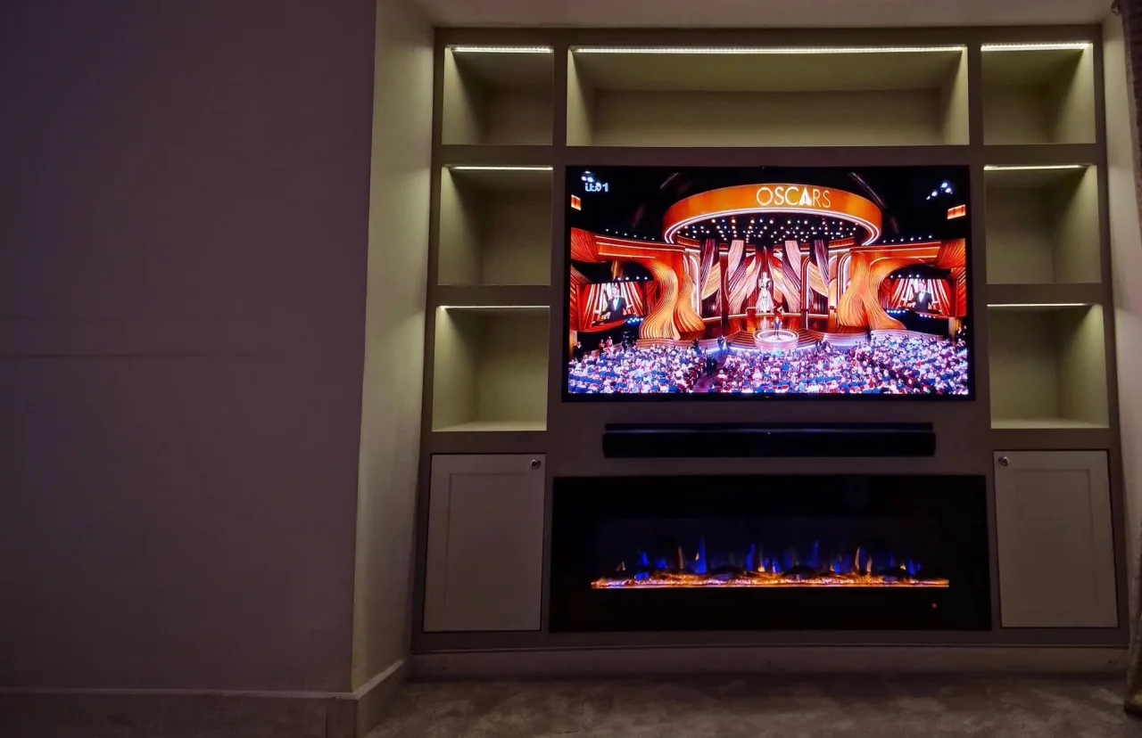 Bespoke home cinema and media wall installation with recessed lighting